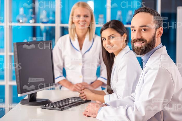 Scientists Working With Computer At Laboratory Stock Photo