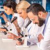 Chemists Using Microscopes Stock Photo