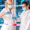 Two Female Researchers Working With Flasks Stock Photo