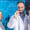 Scientist Writing Chemical Formula Stock Photo