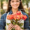 Female Gardener With Flowers Stock Photo