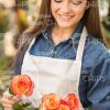 Smiling Woman With Flowers Stock Photo