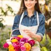 Woman With Basket Of Flowers Stock Photo