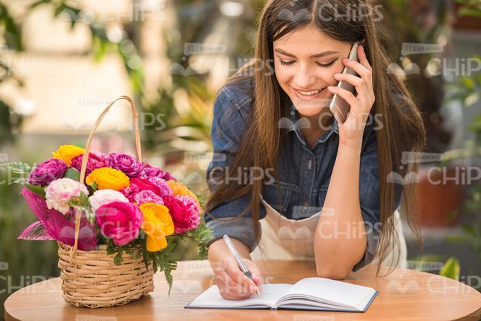 Gardener Talking The Mobile Phone Stock Photo
