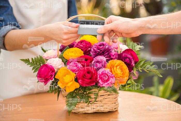 Buyer Gives Payment Card To Gardener Stock Photo