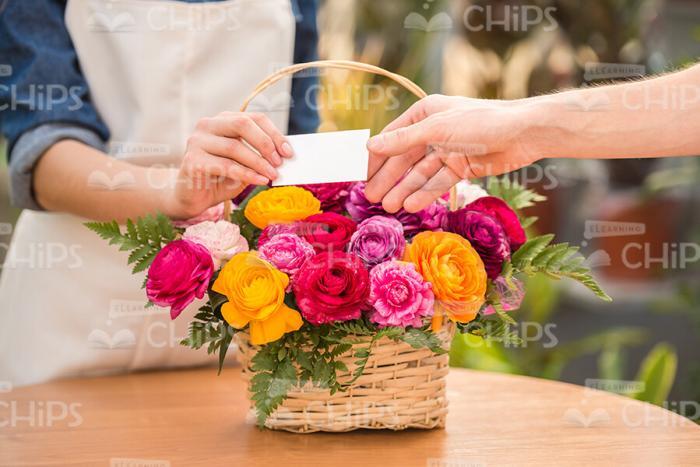 Gardener Gives Business Card Sample To Client Stock Photo