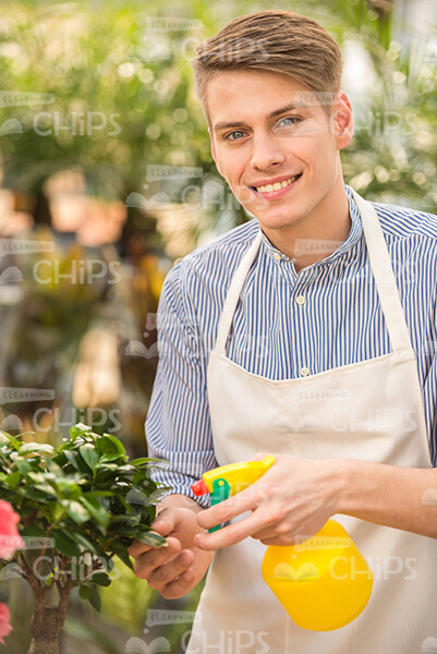 Male Gardener Holding Pulverizer Stock Photo