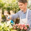 Happy Guy Sprays Flowers Stock Photo