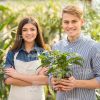 Young Man Bought Pot with Plant Stock Photo