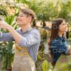 Handsome Gardeners Using Pulverizers Stock Photo