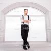 Handsome Man Standing In Front Of Window Stock Photo