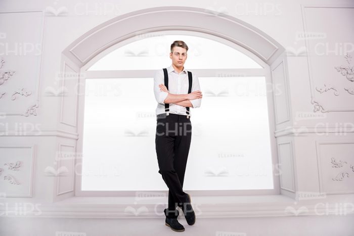 Handsome Man Standing In Front Of Window Stock Photo