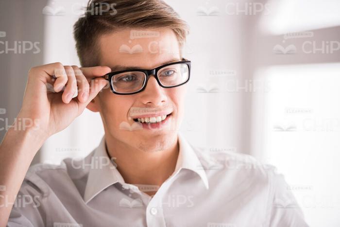 Close Up Stock Photo Of Businessman Touches The Glasses