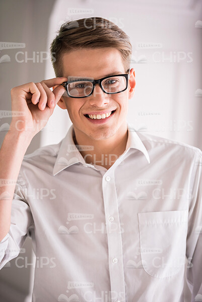 Smiling Young Man In White Classic Shirt Stock Photo