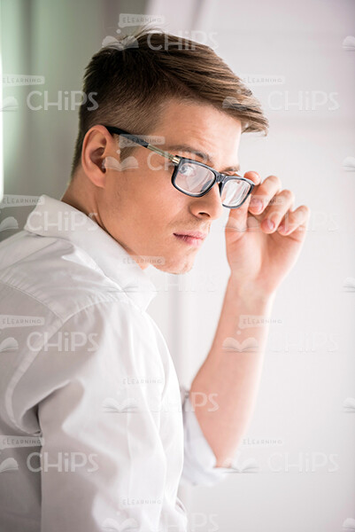Half-Turned Man Wearing Eye Glasses Stock Photo