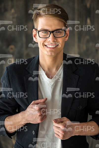 Young Man Wears Jacket and Smiles Stock Photo