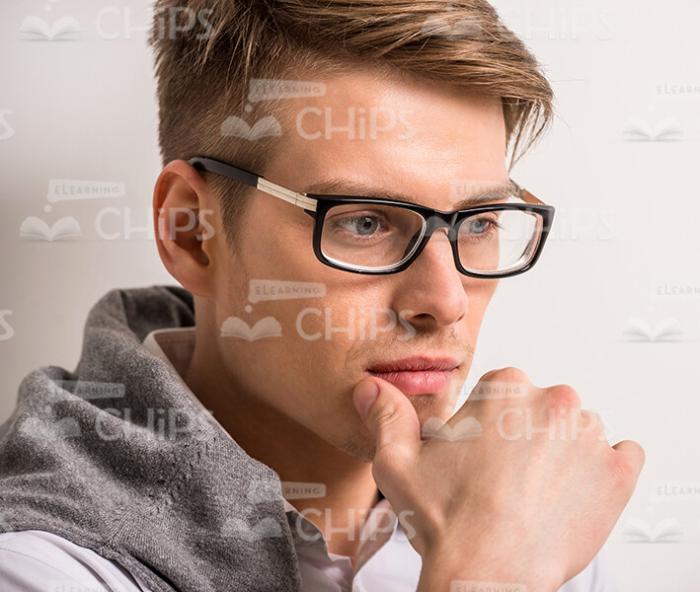 Close Up Young Man Makes Thoughtful Gesture Stock Photo
