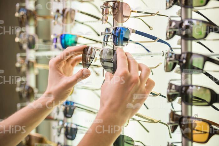 Holding Glasses With Both Hands Stock Photo