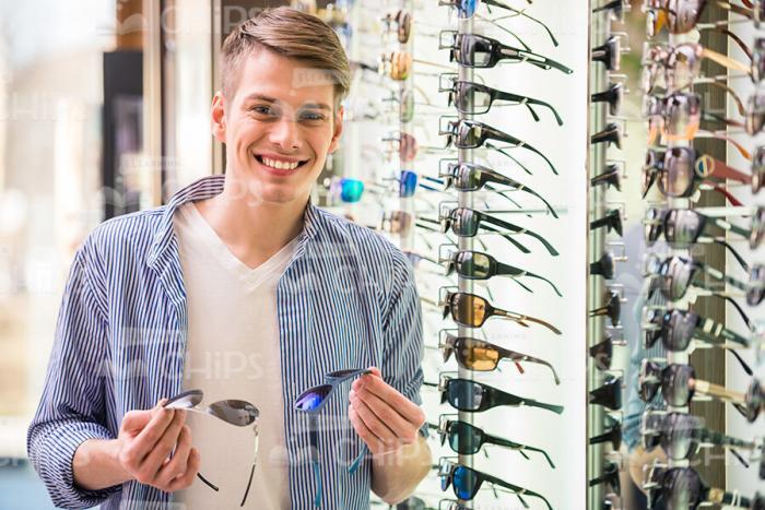Excited Man Buying Glasses Stock Photo