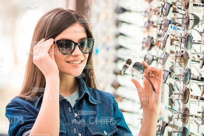 Handsome Girl Tries On Glasses Stock Photo