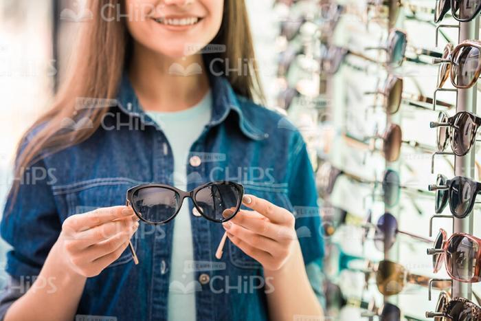 Glasses In Woman's Hands Stock Photo