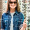 Woman Trying On Glasses And MAking Thumb Up Gesture Stock Photo