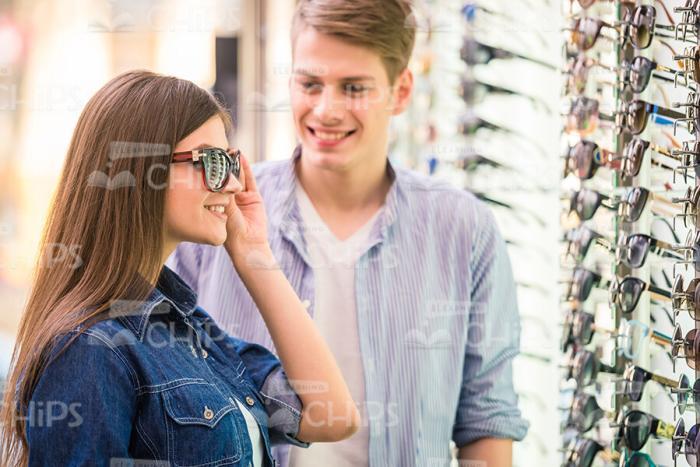 Couple Choosing Glasses Stock Photo