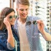 Young Couple At Sunglasses Shop Stock Photo