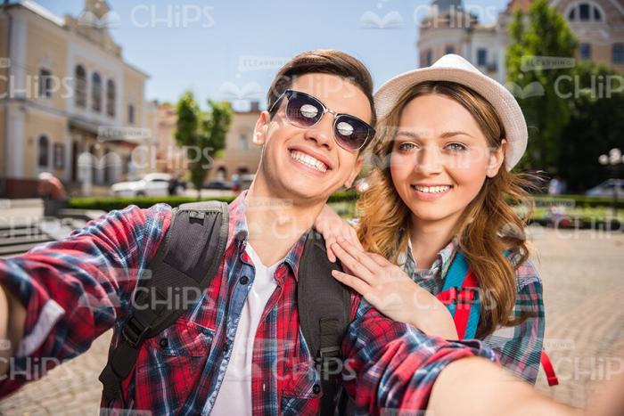Smiling Couple Of Tourists Taking Selfie Stock Photo