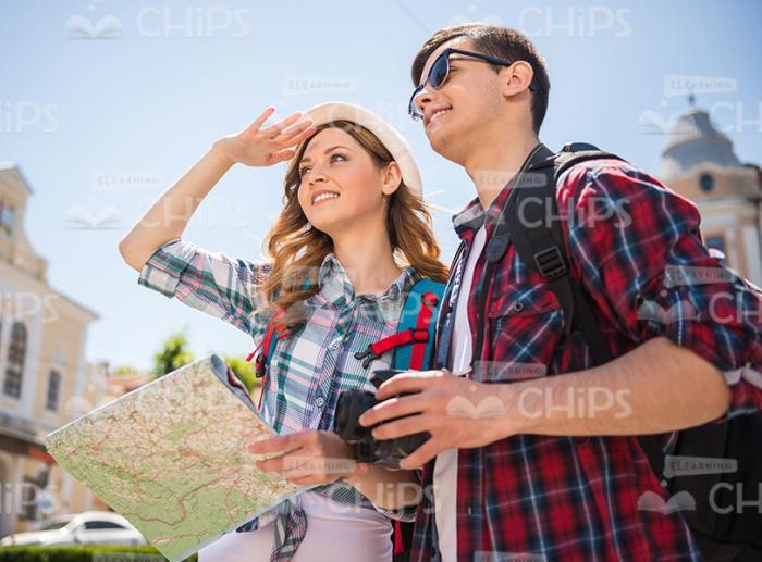 Two Handsome Young Tourists Looking Into The Distance Stock Photo