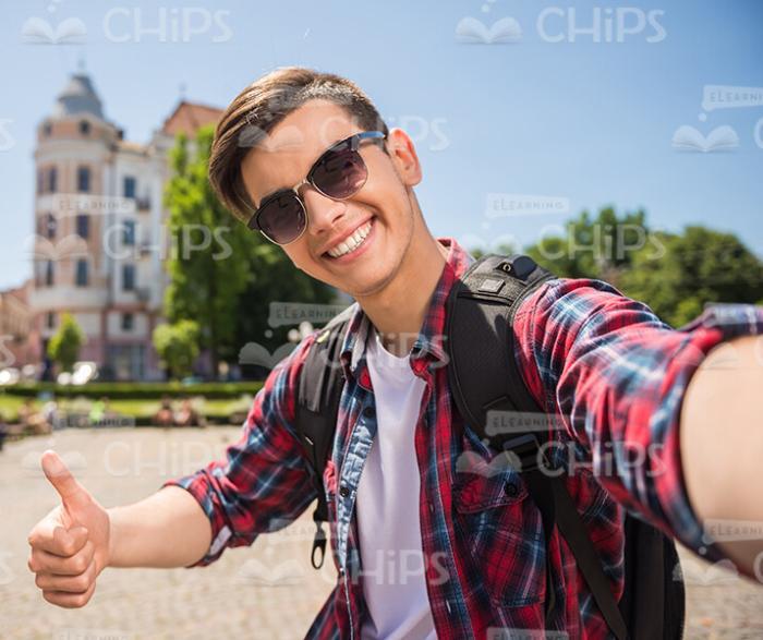 Nice Young Man Showing Thumb Up Stock Photo