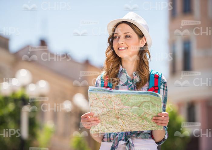 Smiling Woman Traveling With Map Stock Photo