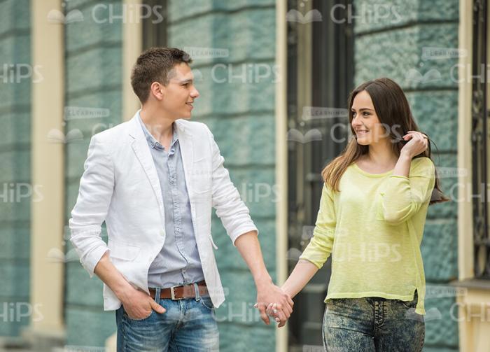 Two Good-Looking Young Friends Holding Each Others Hands Stock Photo