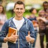 Young Man Showing Thumb Up Stock Photo