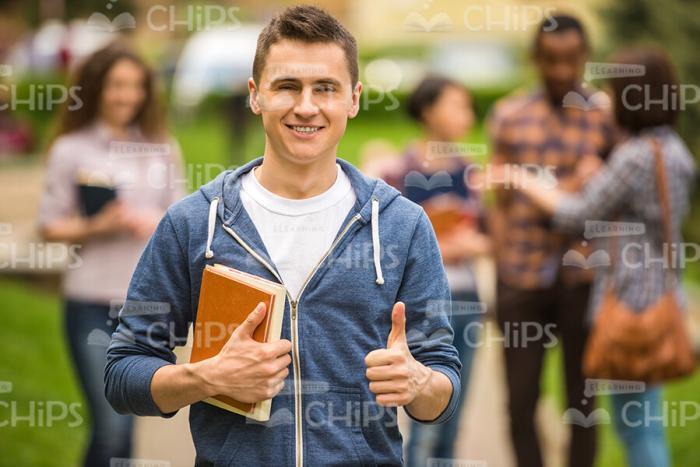 Young Man Showing Thumb Up Stock Photo