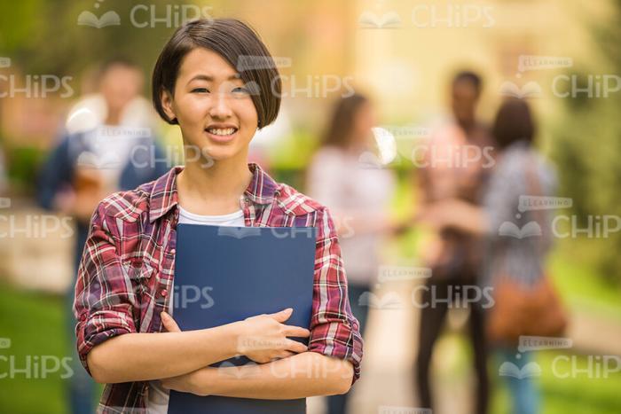 Nice Asian Student Crosses Arms Stock Photo
