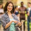 Nice Young Woman Uses Tablet Outdoors Stock Photo