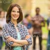 Handsome Young Woman Crosses Her Arms Stock Photo