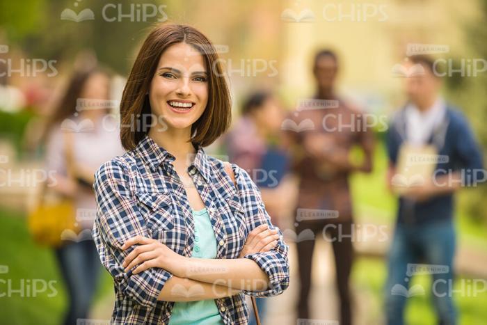 Handsome Young Woman Crosses Her Arms Stock Photo