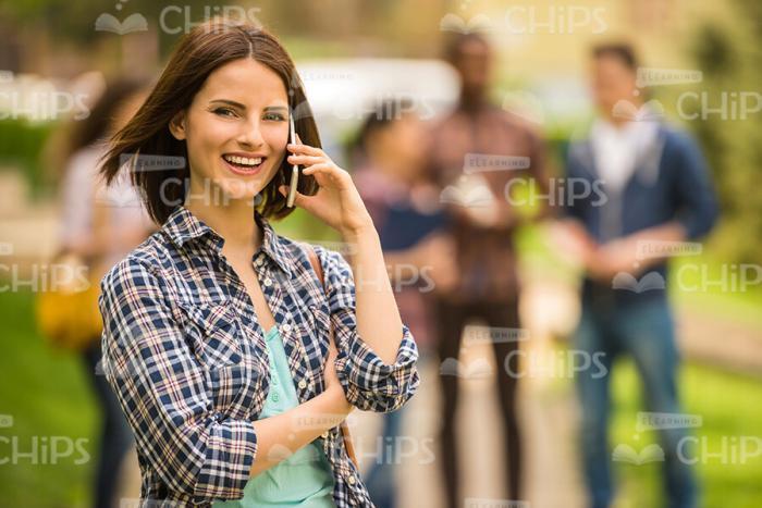 Pretty Young Student Talking On Mobile Phone Stock Photo