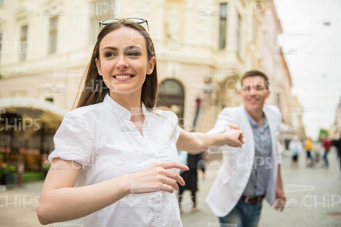 Young Girl Pulls Boyfriend's Hand Stock Photo