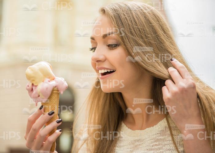 Handsome Young Woman Eating Ice Cream Stock Photo