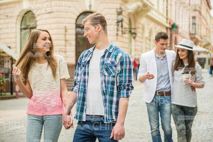 Two Couples Walking Together Stock Photo