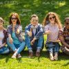 Young People Making Thumbs Up Gestures Together Stock Photo