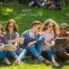 Happy Young Students Learning Outdoors Stock Photo