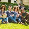 Young People Studying At Park Stock Photo