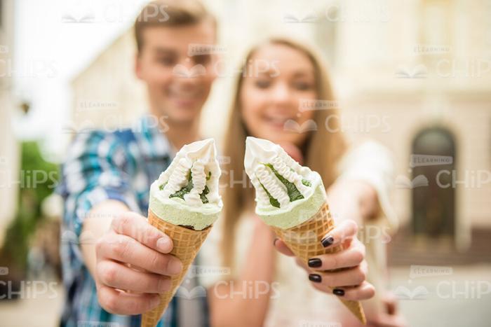 Close Up Ice Cream Holding By Young Couple Stock Photo