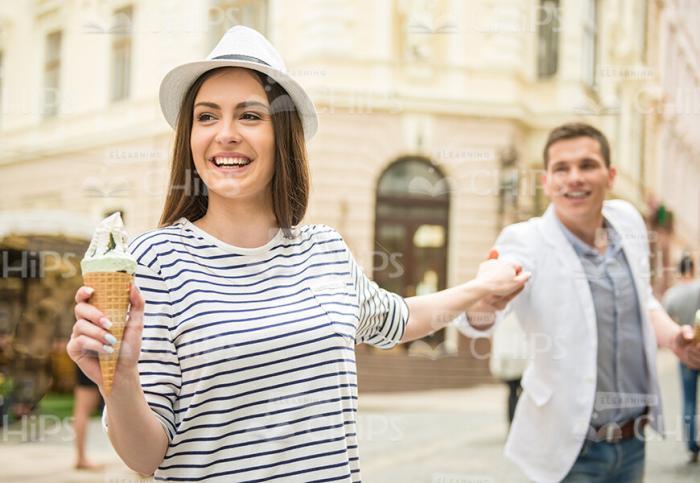 Smiling Young Couple Going Somewhere Stock Photo