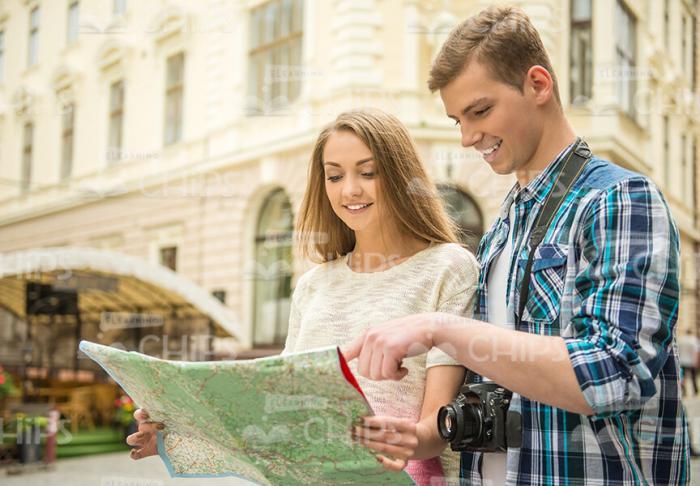 Handsome Young Couple Looking At Map Stock Photo