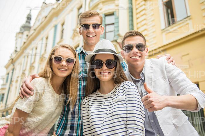 Four Friends Wearing Sunglasses Stock Photo
